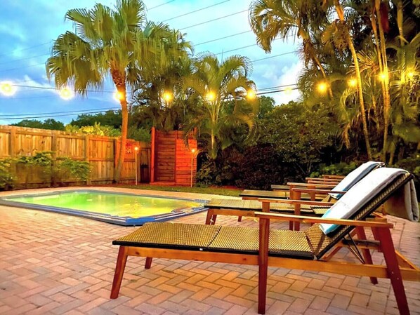 Delight in our 10-person deep swim spa, a hot/cold tropical oasis with garden shower