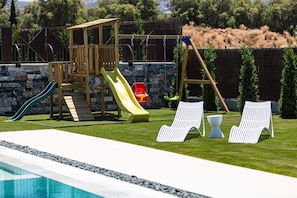 Children playground and lawn chairs make it easy to watch over little ones