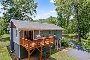 Back deck with gas grill and seating area