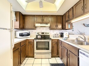 Kitchen with wood counter and tile flooring