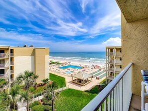 View from high of pool and ocean.