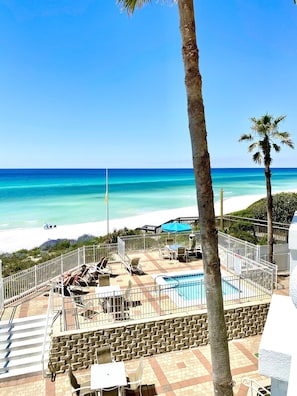 View of the hot tub and beach from the private balcony