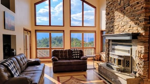 Central to the home is the living room with a 2 story wall of windows.