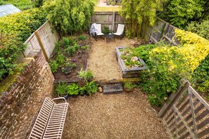 The Smokehouse, Ingoldisthorpe:  View of the garden from the Juliet balcony
