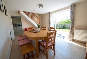 Avocet House, West Lulworth: Dining room with doors to the garden