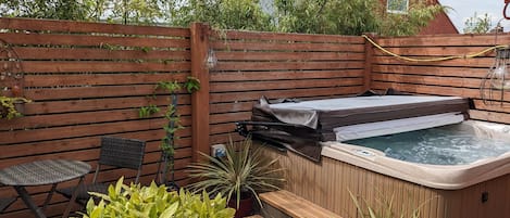 The court yard garden and hot tub is the perfect place to relax and unwind