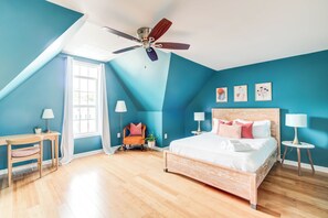 Primary suite with a king bed and private bathroom. 