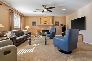 Family Room 70" Flat Screen & Fire Place