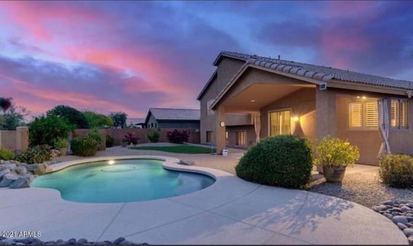 Back yard pool area at night.