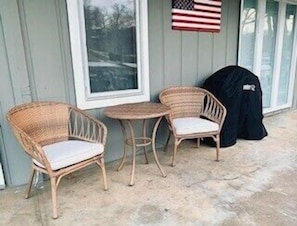 Table and chairs on lakefront patio with great views of our cove.   