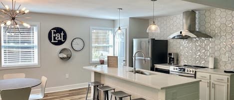 Fully furnished kitchen complete with toaster and coffee pot.