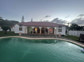 Villa & pool view from cliff wall