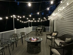 Enjoy a cozy evening by the fire with the twinkling bistro lights!