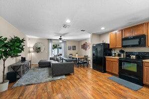 gorgeous and spacious open floor plan in this townhome. Showing kitchen, dining and living rooms