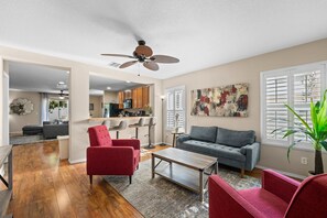 front sitting room showing seating and breakfast bar