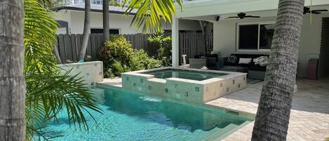 Sparkling refreshing pool surrounded by lush landscape