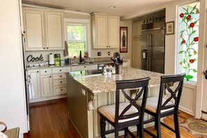 The gourmet kitchen with seating for 2 at the bar.