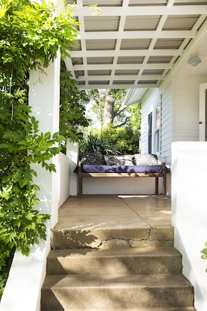 Wisteria frames the verandah to Harvest House.