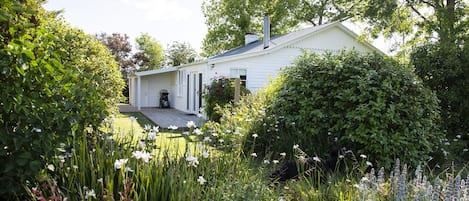 Harvest House nestles in mature gardens