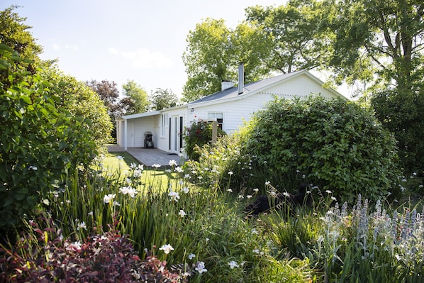 Harvest House nestles in mature gardens