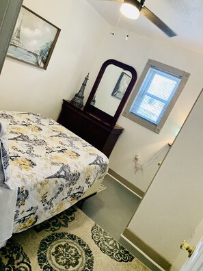 Master Bedroom  with Dresser, closest, hangers, luggage rack & extra blanket