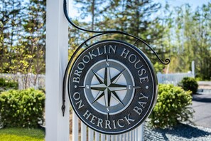 Our house sign on the street side of our entry driveway