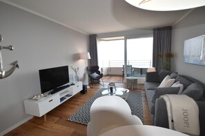 spacious, bright living area with access to the balcony