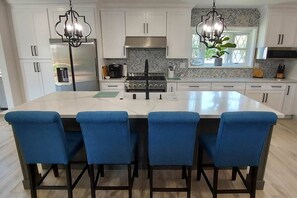 Experience cooking in a professional cook's kitchen with 9-foot island! 