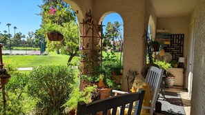patio with slider access from living room and bedroom to walking path/tennis 