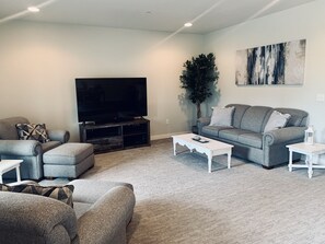 Large, open concept space. Living area connects to dining room & kitchen.