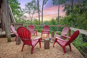 Lower Level Outdoor Firepit with Adirondack Chairs and Firewood Provided