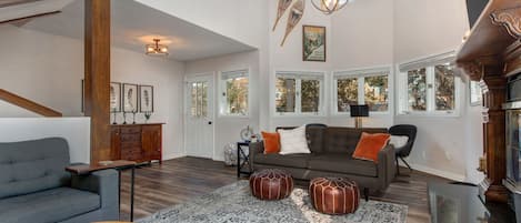 A spacious living room with 20' ceilings provides a large open environment.