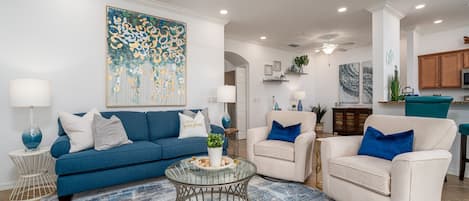 Cozy living room looking out to the spectacular golf course view