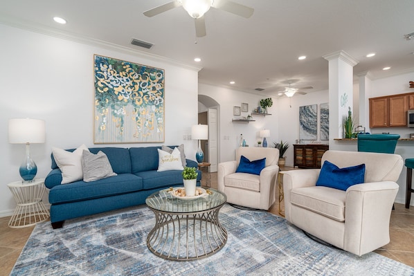 Cozy living room looking out to the spectacular golf course view