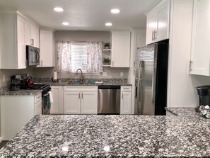 Kitchen with bar that seats 4