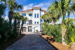 Private stone driveway leading to your dream vacation oasis