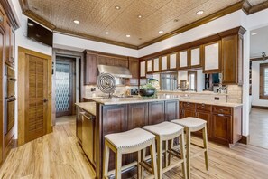 Incredible gourmet kitchen with Italian granite countertops, soft close cabinetry, and a walk in pantry