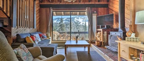 Living room with large 4K TV, Blu-ray & fireplace looking out to the ski slopes!