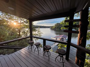 Covered bar built into bluff and aluminum boat dock.