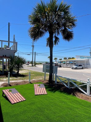 Enjoy cornhole while watching the waves!
BBQ (new-gas) on front patio.