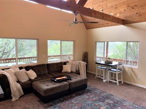 Main living area. Includes two high top tables and huge sofa. 