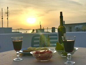 Enjoy your evenings watching the sun set over Paros island.