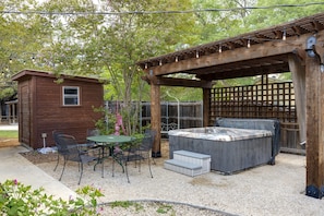 Outdoor covered hot tub near Mainstreet.