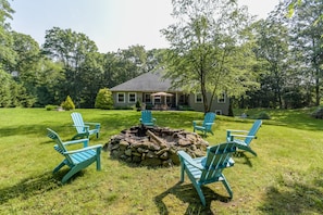 Backyard firepit and perfect spot for yard games