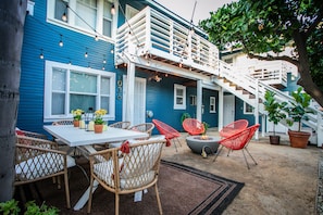 Serene patio haven with firepit. Your apartment is upstairs.