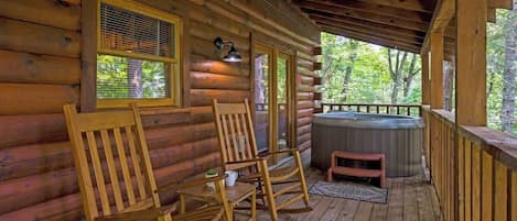 Relax on the private back deck with hot tub