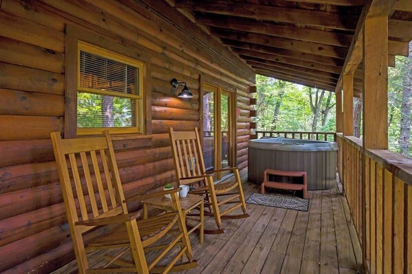 Relax on the private back deck with hot tub
