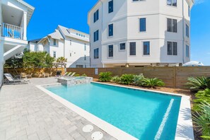 Pool Area With Dining and Lounge Chairs