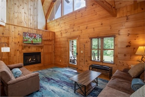 Living Room with fireplace (couch converts to full bed)