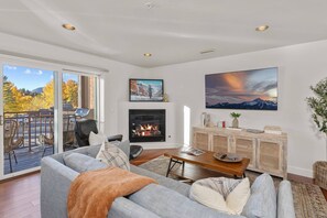 Cozy living room equipped with gas fireplace and smart TV